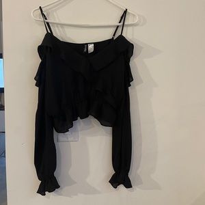 Black ruffled long sleeve cropped blouse